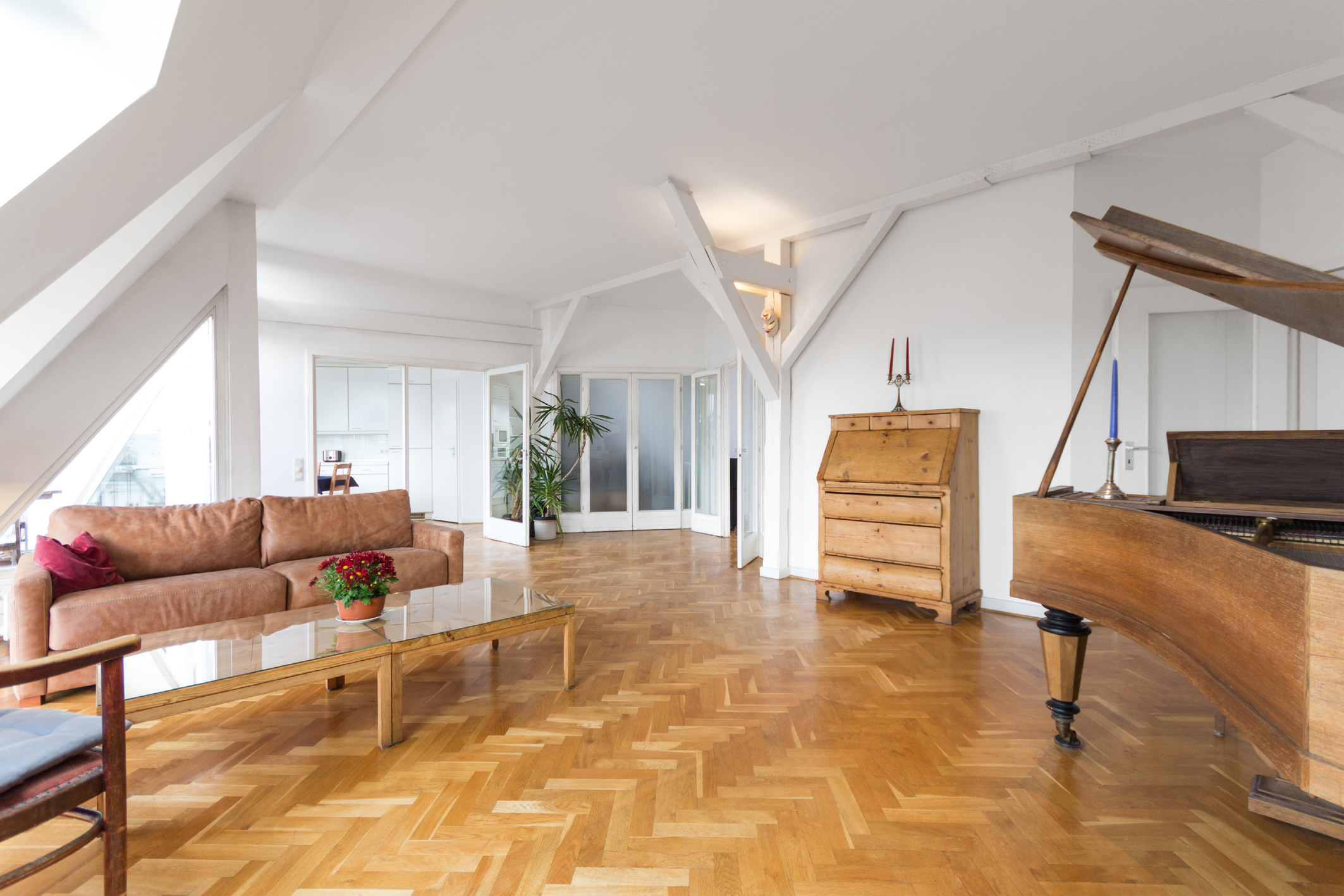 living room with fishbone parquet and piano in beautiful apartment home